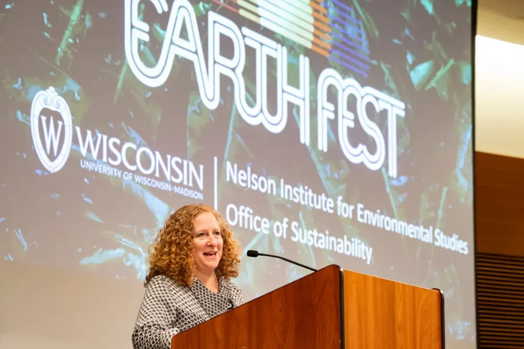 Jennifer Mnoonkin speaking at a podium during Earth Fest